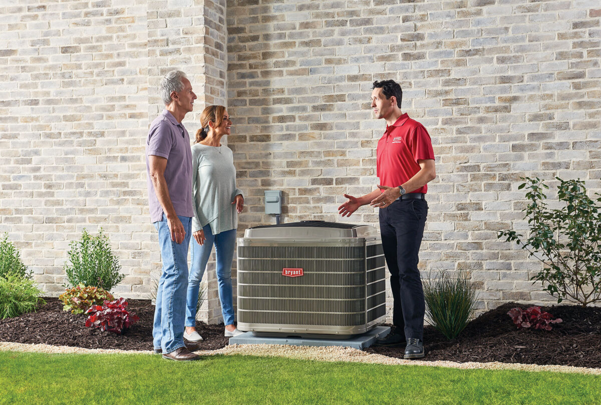 bryant ac unit with dealer outdoors talking to homeowners